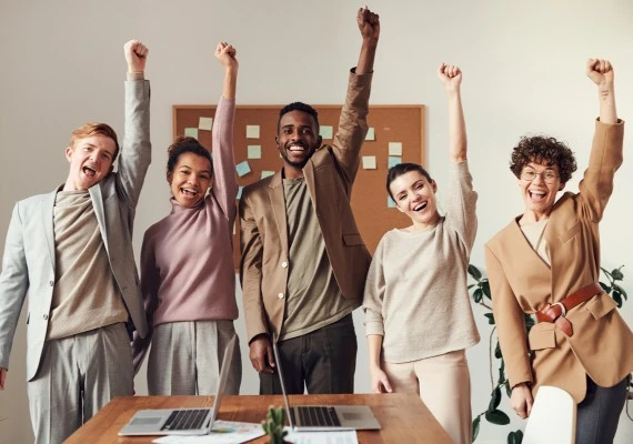 team holding hand upwards